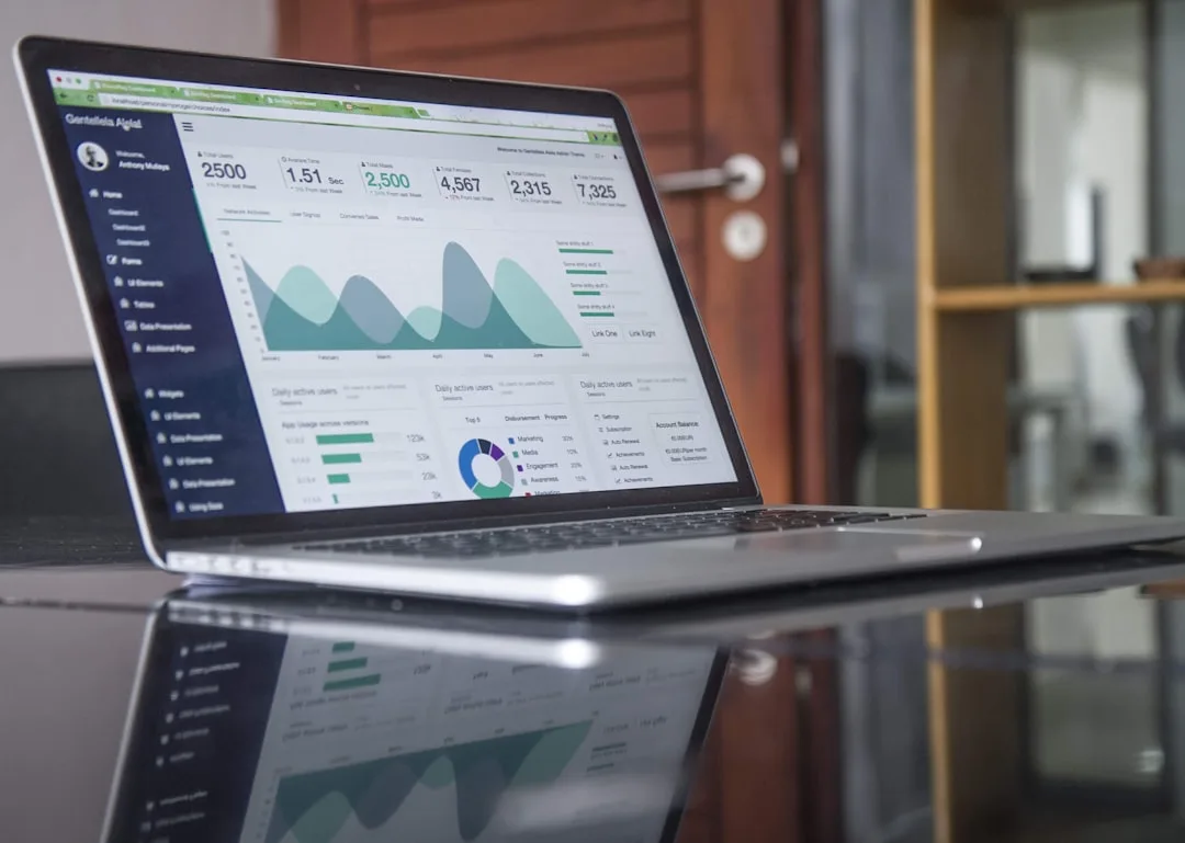 Open laptop on a desk showing an e-commerce website dashboard in a bright modern London workspace
