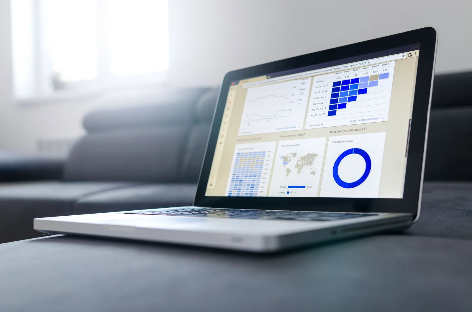 Open laptop on a bright desk showing a website analytics dashboard for local SEO tracking